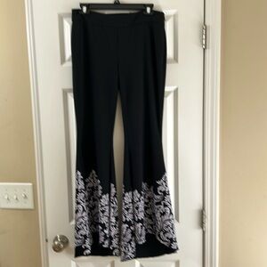 INC black pants with flowers on bottom, stretch material, bell bottoms size 6